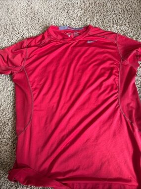 Red Nike pro combat shirt /fitted in a size extra large